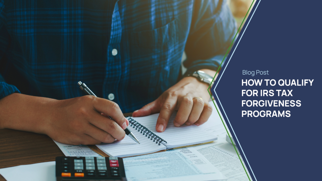 A person in a blue plaid shirt writing in a notebook with tax documents, a calculator, and a pen on a desk. Overlay text reads 'Blog Post: How to Qualify for IRS Tax Forgiveness Programs.