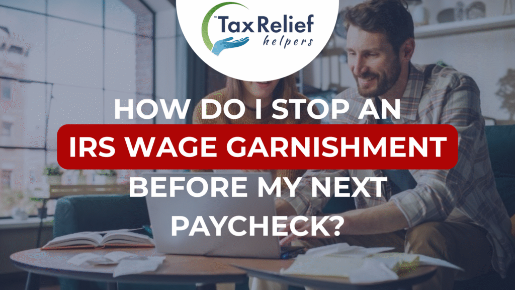 A couple doing their taxes in the kitchen.