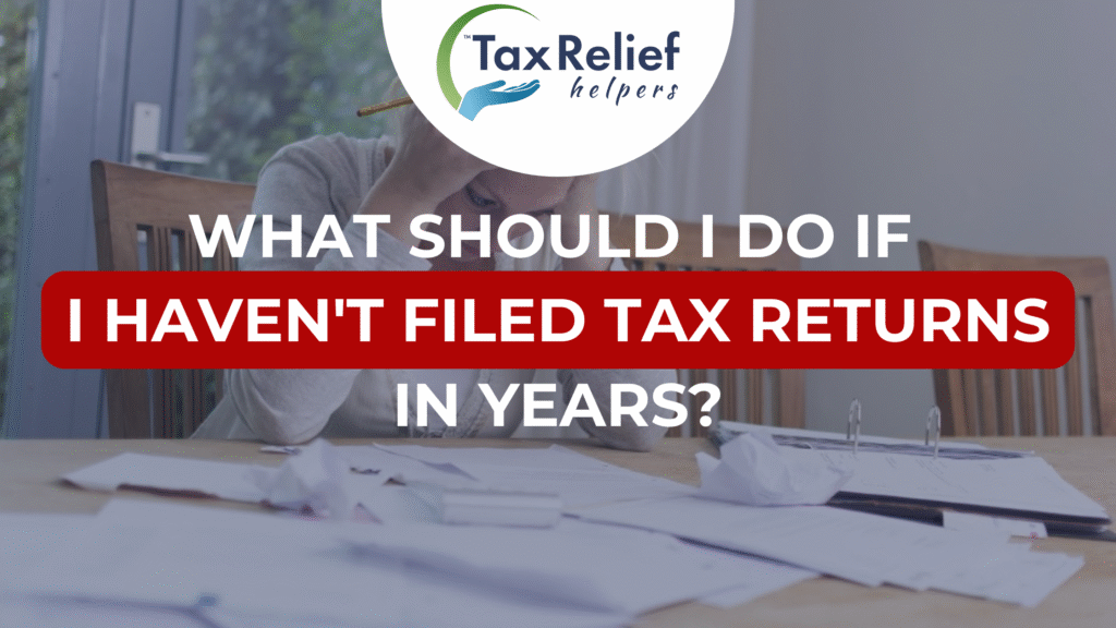 A person looking at her tax papers on the kitchen table feeling overwhelmed.